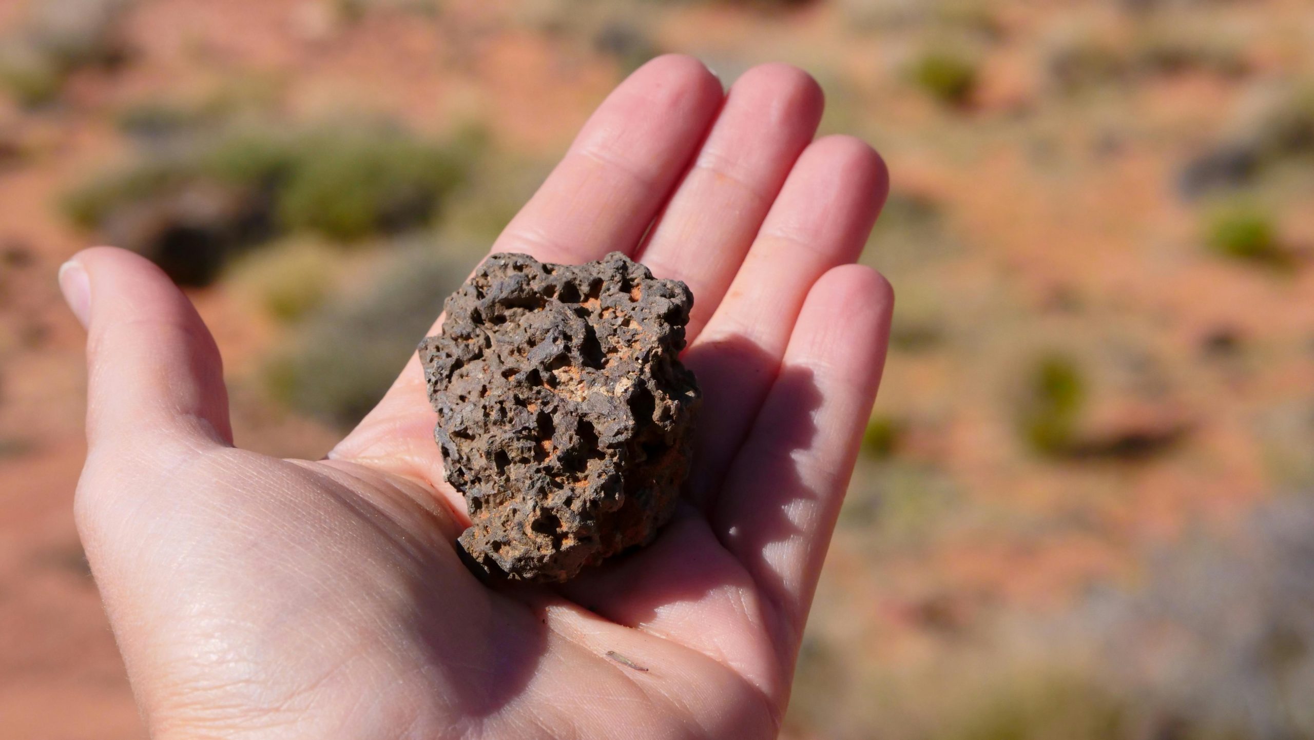 Hand holding rock